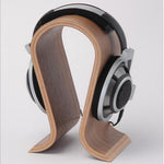 Curved wooden headphone stand